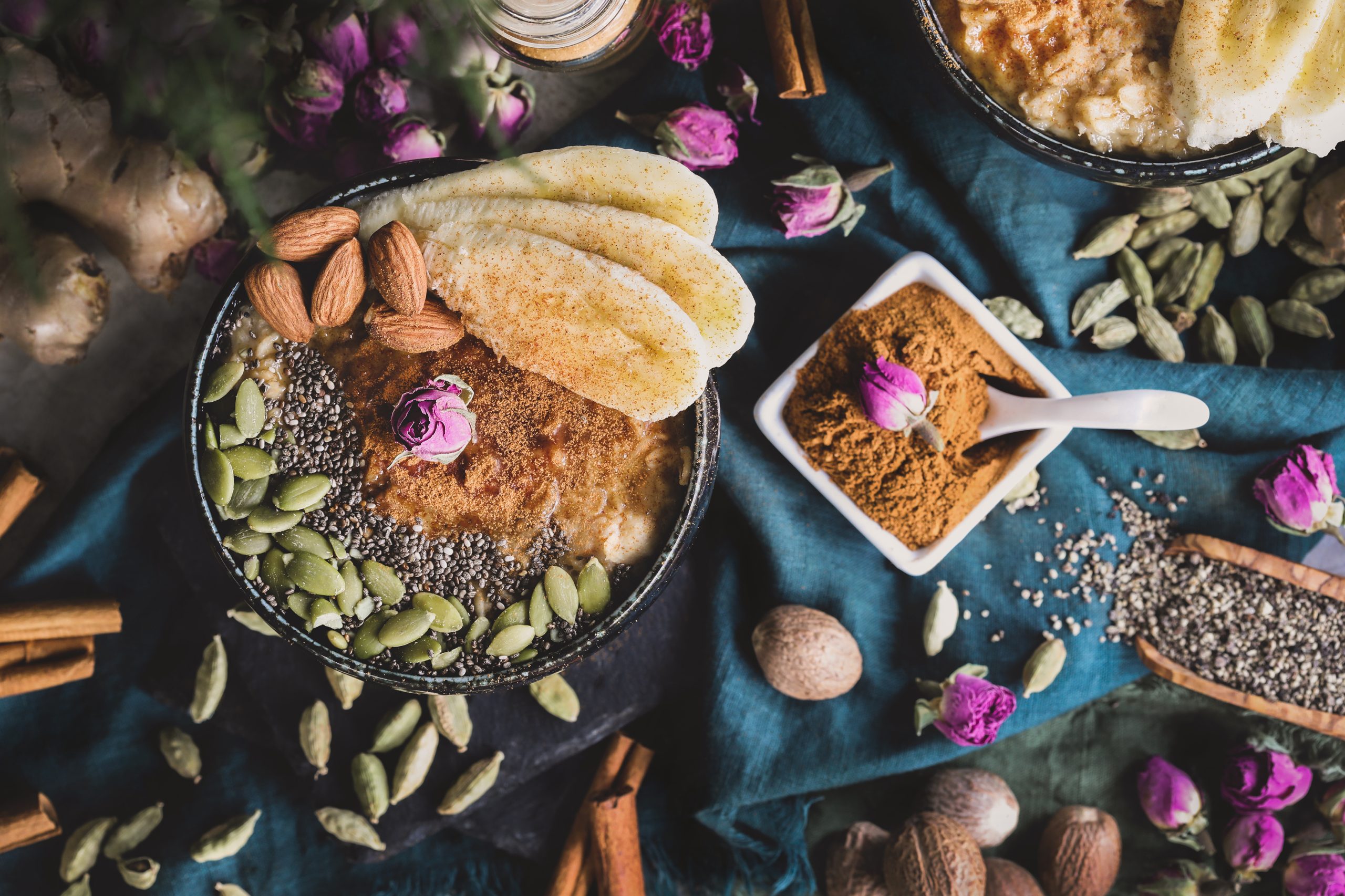Advieh seasoned oatmeal sits out surrounded by spices