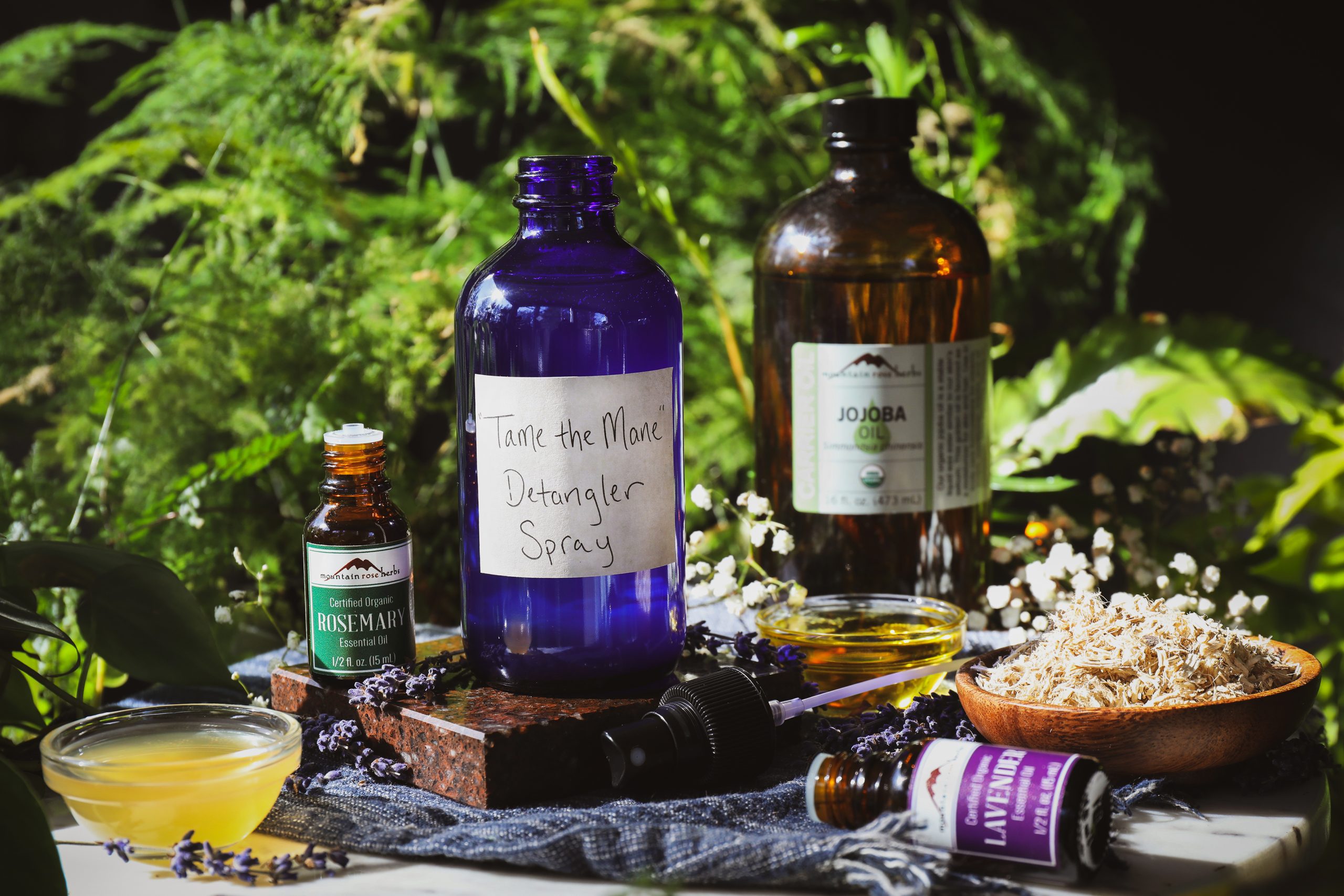 Detangler spray and ingredients sit out