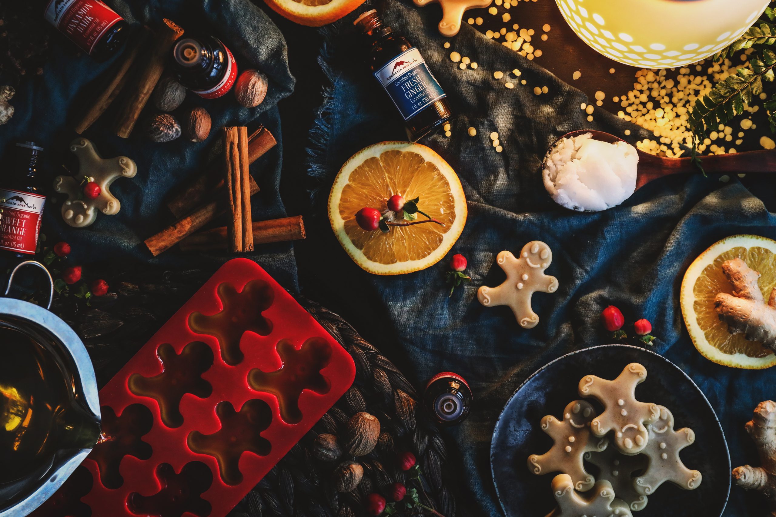 Hot wax is poured into a mould in the midst of a cheery work station.
