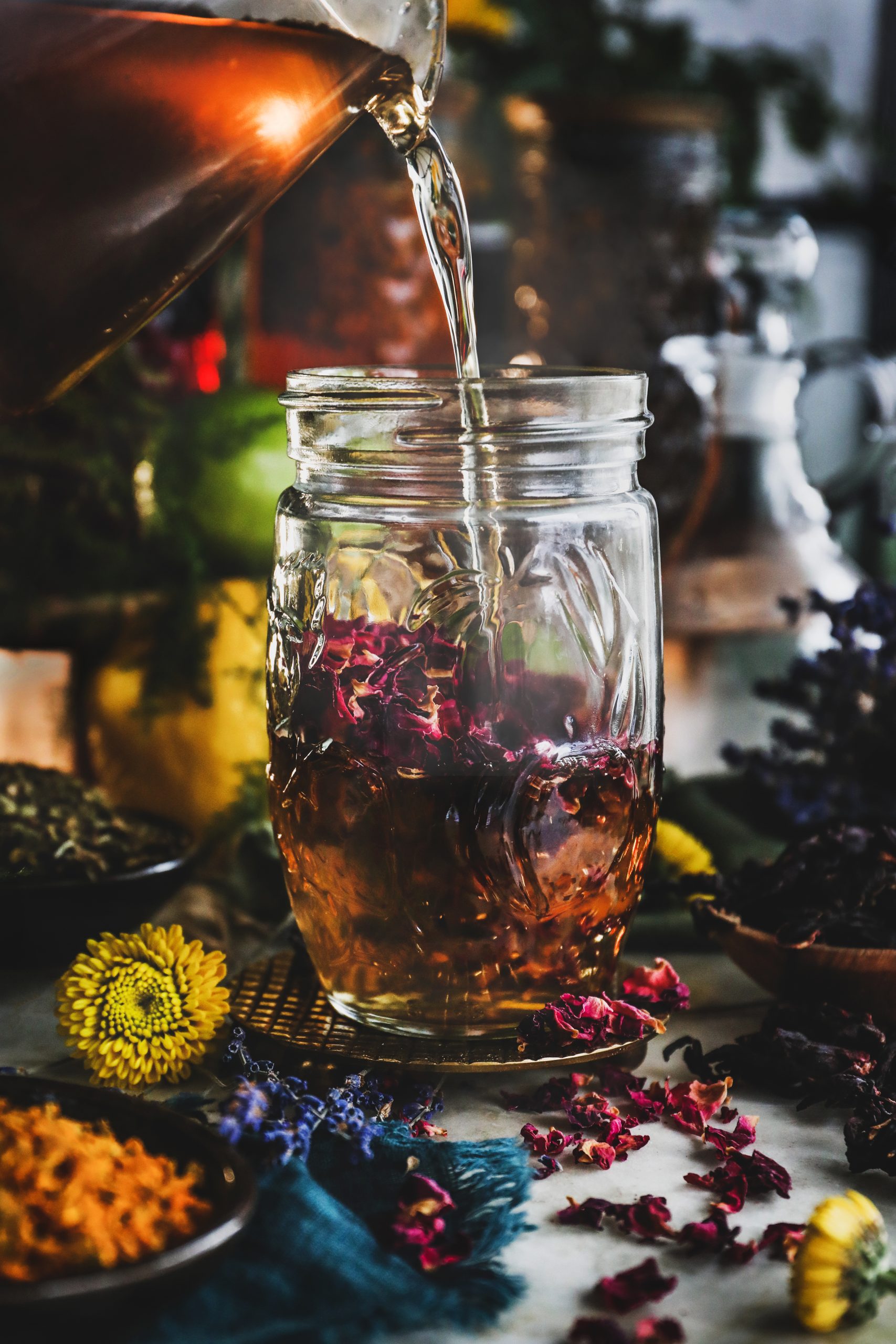 Warm simple syrup is poured over dried rose petals