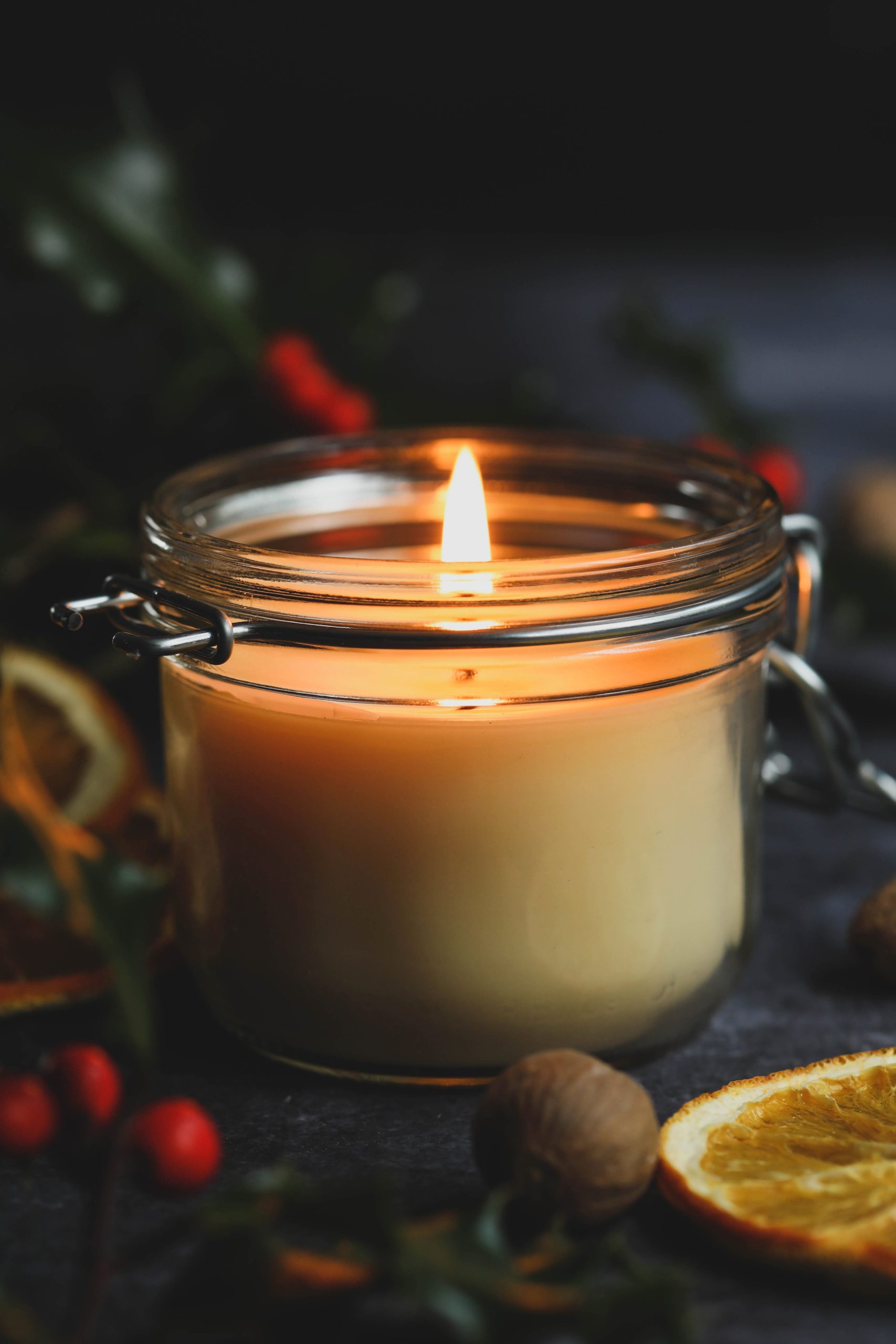 DIY spiced cream beeswax candle burning in a jar