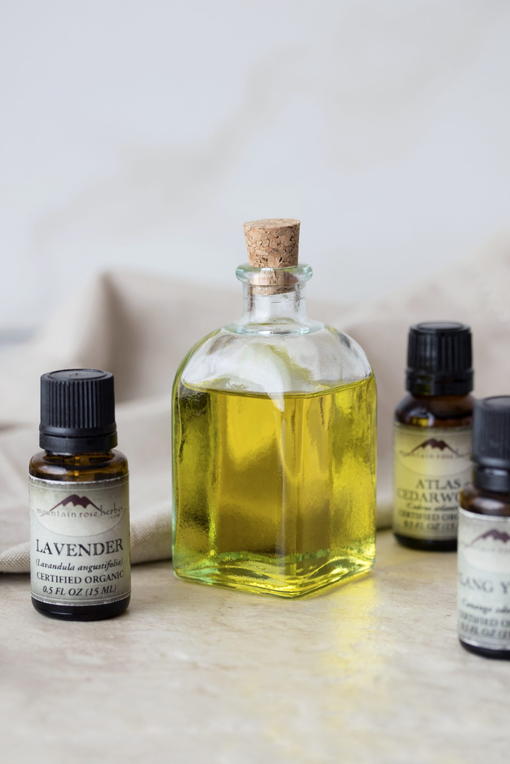 A love-inspired massage oil uses essential oils of lavender, atlas cedarwood, and ylang ylang along with jojoba oil to create a golden oil for relaxing massages. 