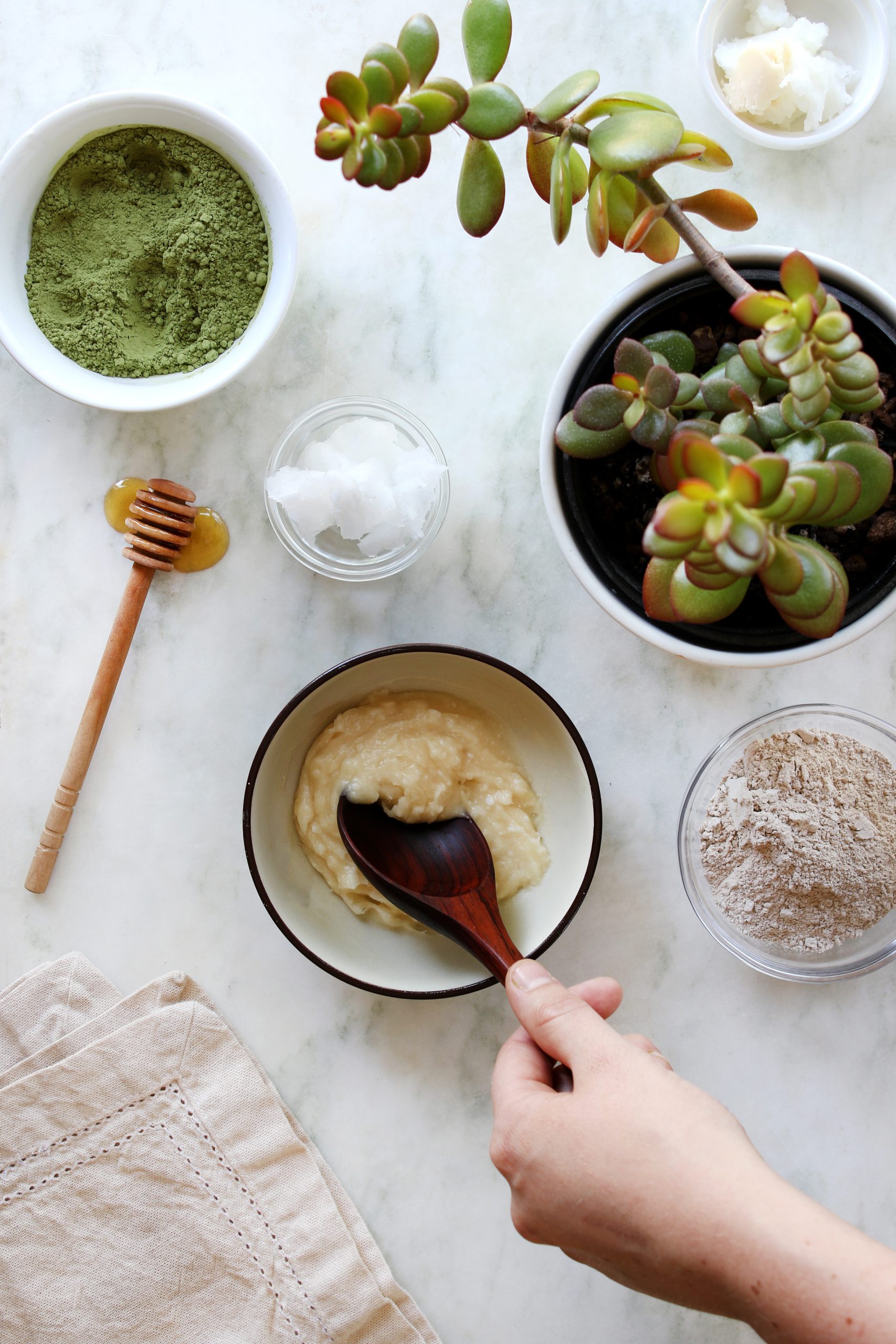 Honey and organic coconut oil are combined and soon to be added with organic matcha tea and white cosmetic, kaolin clay. 