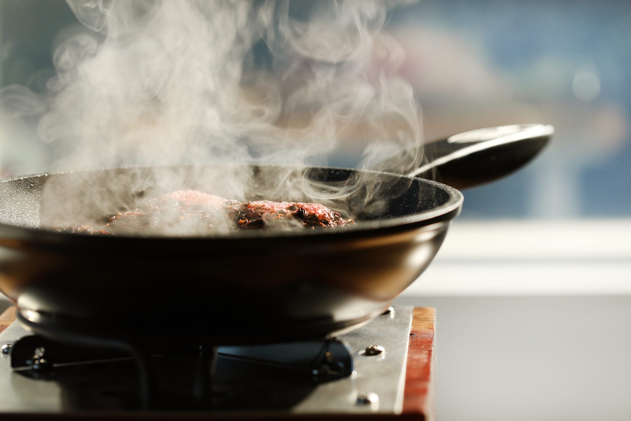 And oxymel decoction boiling on a hot plate is infused with herbs for wellness. 