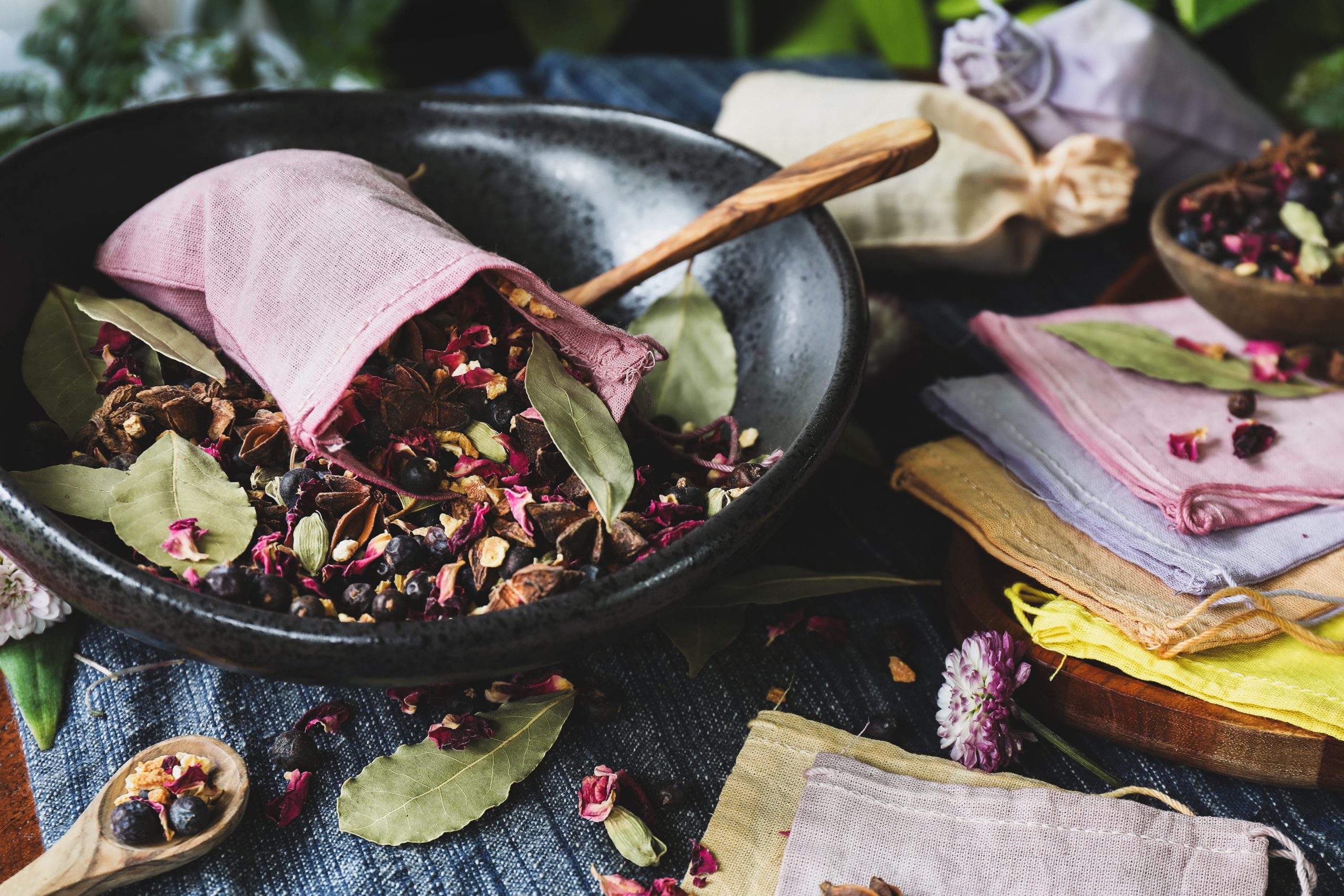 A beautiful dyed muslin bag is filled with herbal potpourri