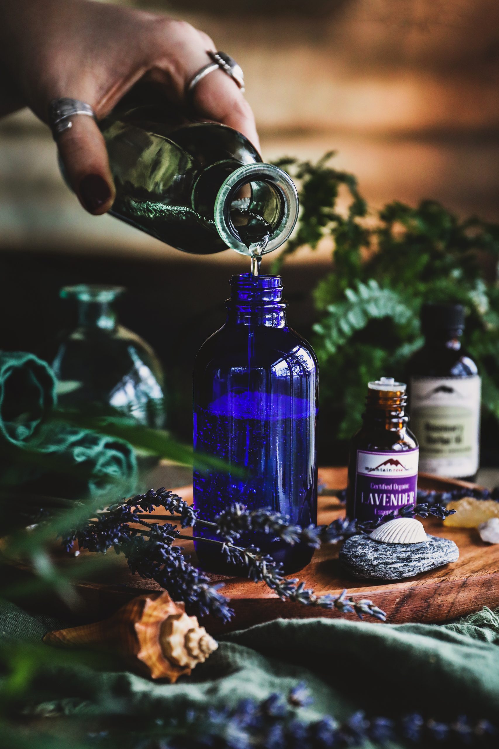 Ingredients for shampoo concentrate are poured into a bottle