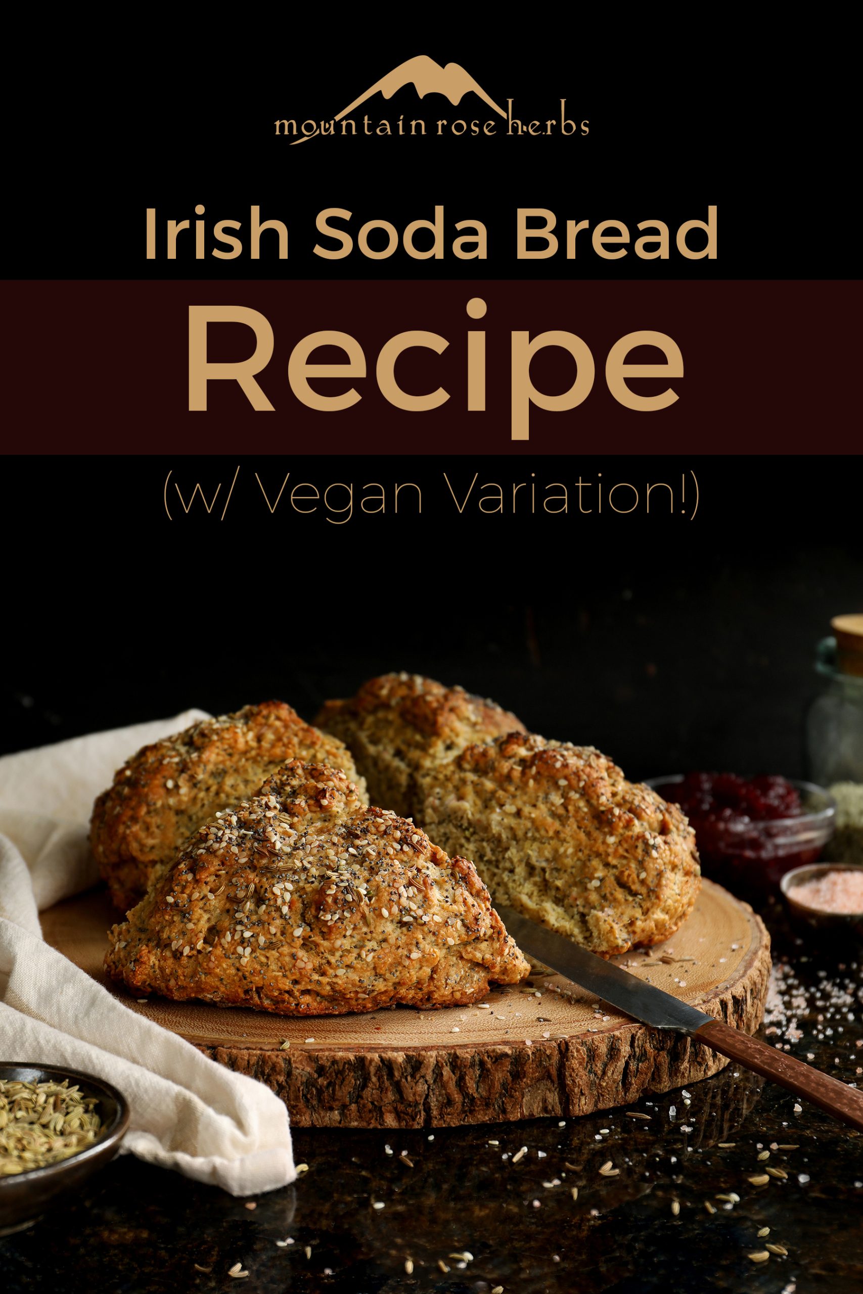 Finished loaf of crunchy Irish soda bread on a natural wooden cutting board served with ruby red berry jam. 