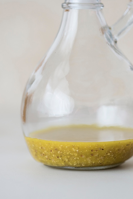 Homemade Vinaigrette in round glass pitcher Homemade Vinaigrette in round glass pitcher