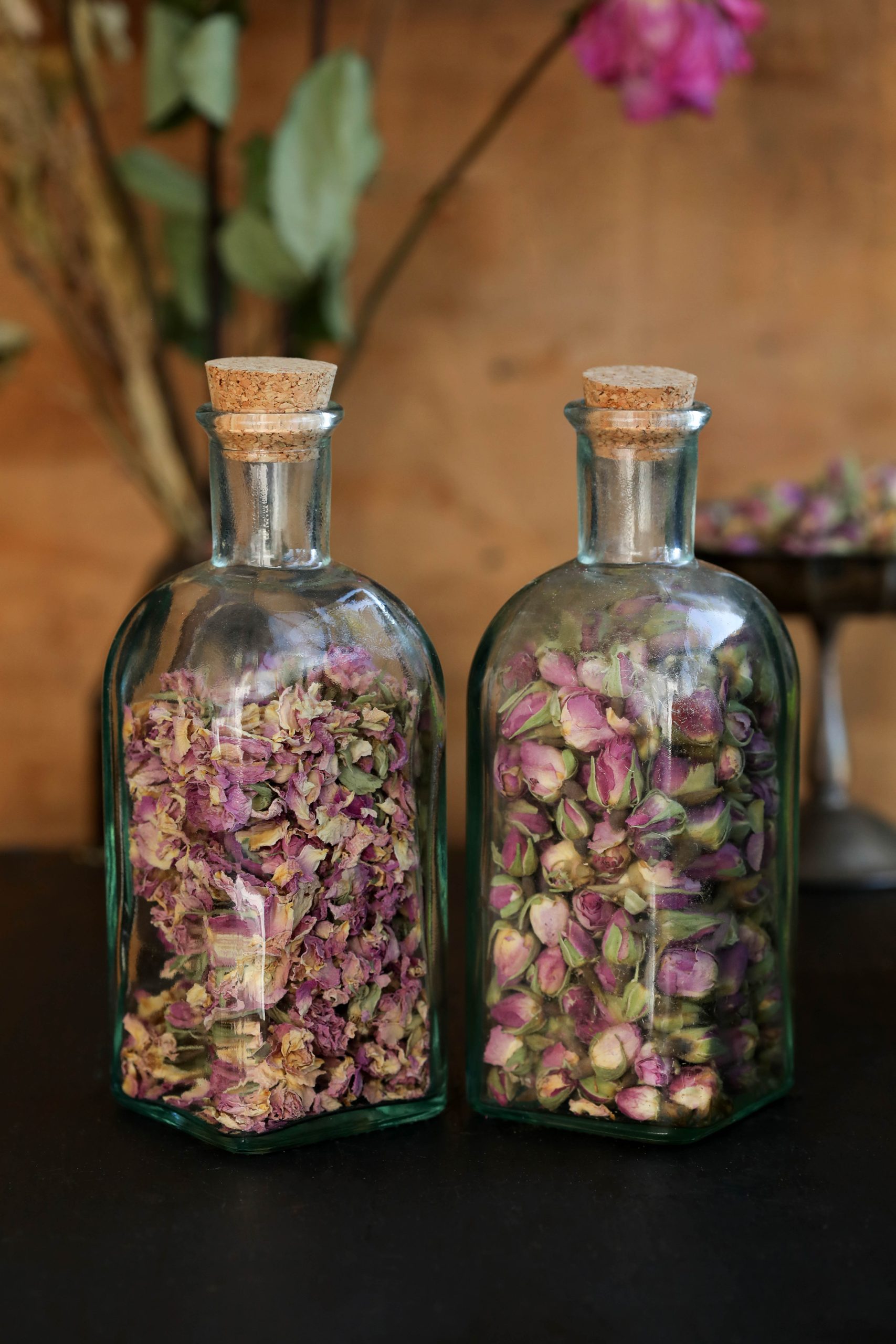 Pink roses are affected by many variables, and can the rose buds can look very different depending on when they were harvested, and other agricultural factors. These pink rose buds arrived in closed, and open forms.