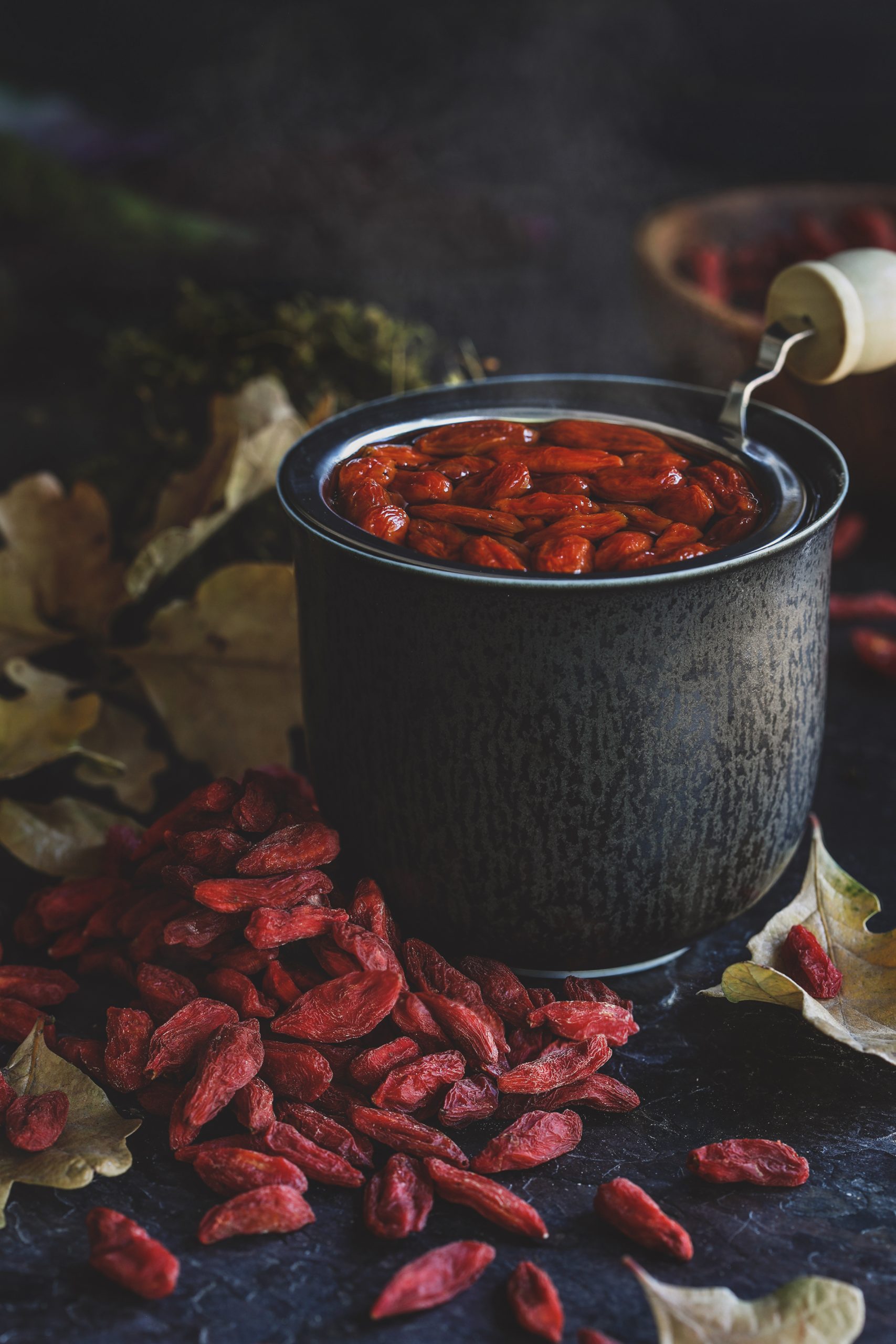 Goji berries, also called lycii berries, soaking in a pot of water.
