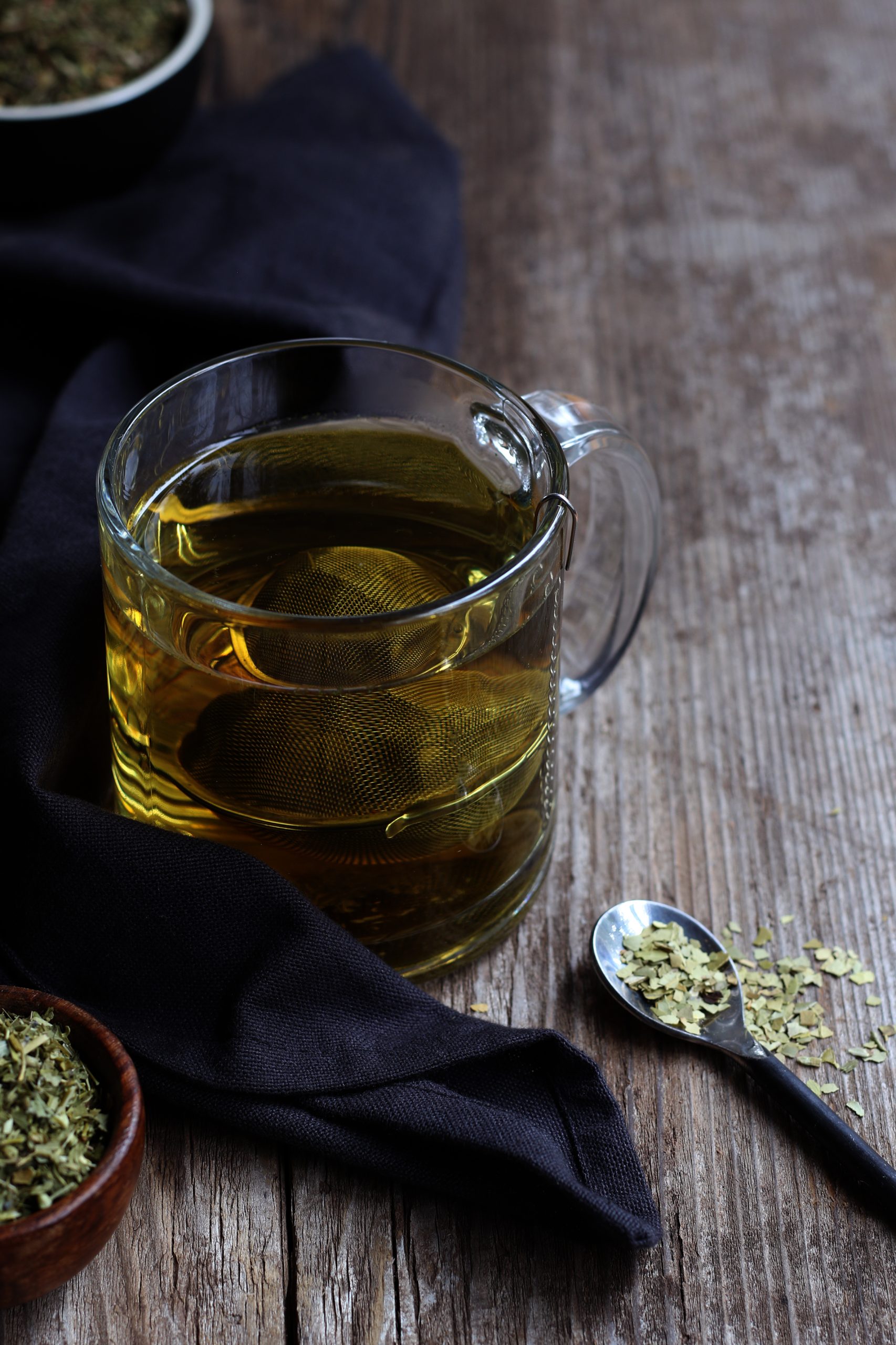 Herbal tea blend for the morning. Ingredients include skullcap, peppermint, and yerba mate. Pale yellow-green tea in a clear mug.