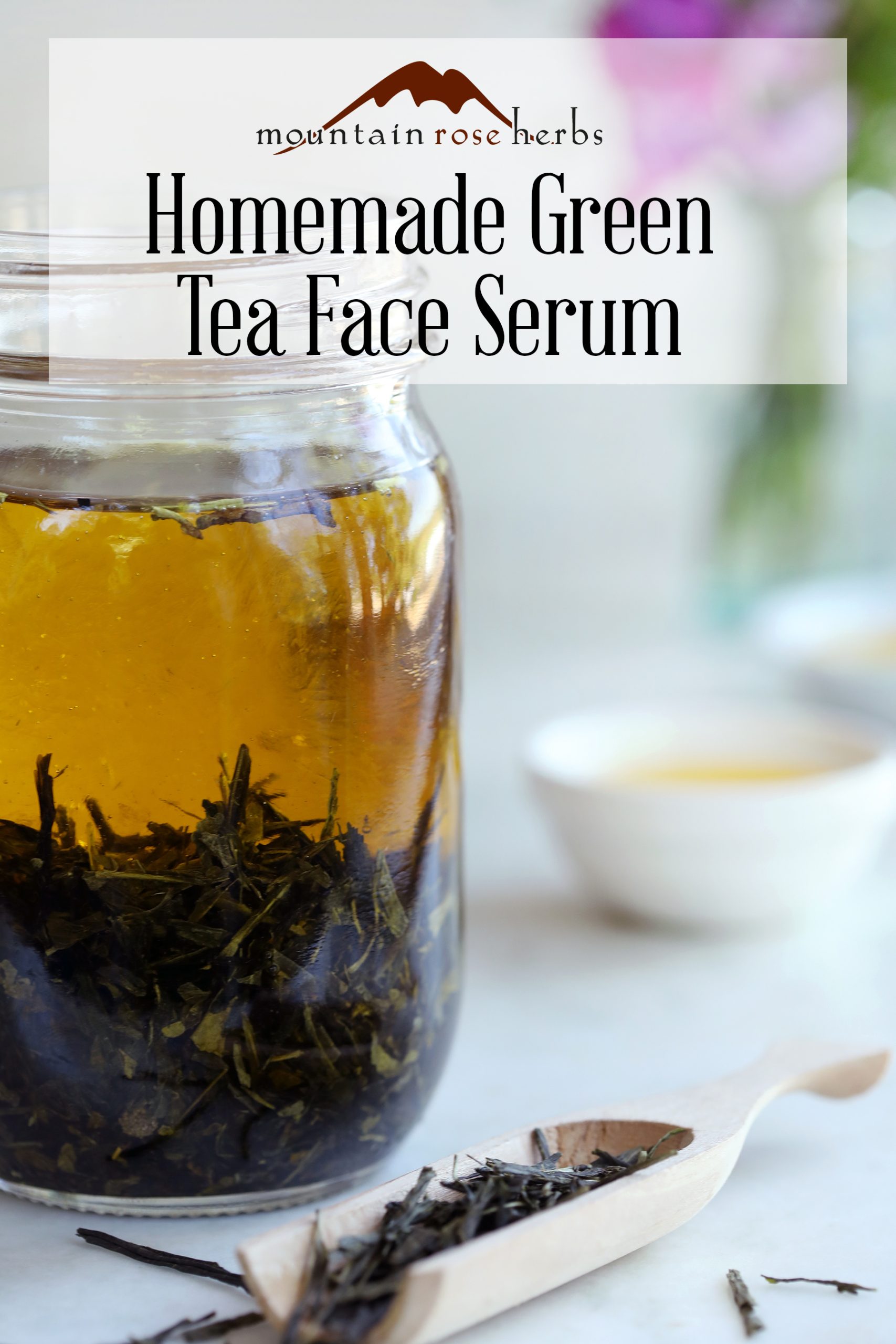 Pinterest link to Mountain Rose Herbs featuring a mason jar infusing a green tea herbal oil, wooden scoop, and dried green tea leaves. 