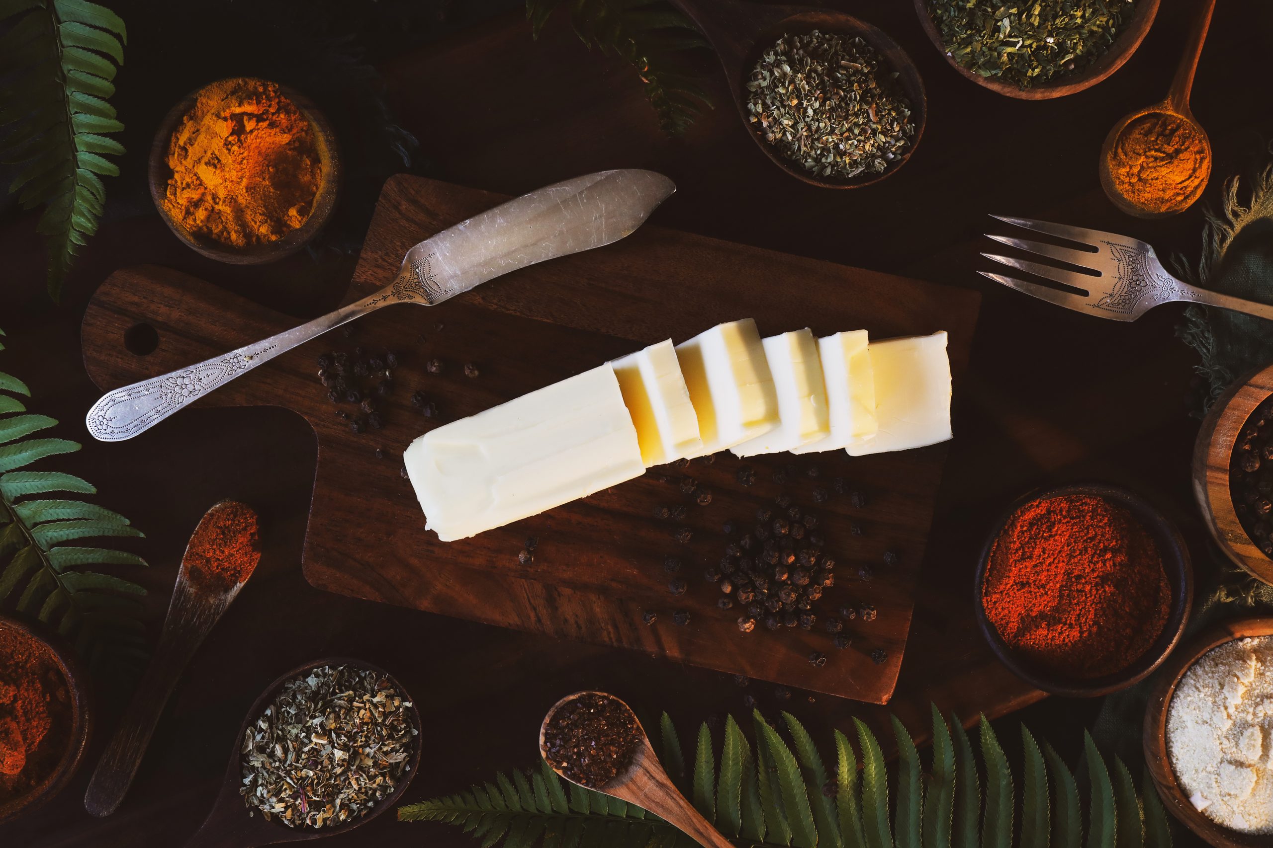 Herbal butter ingredients lay out on a cutting board