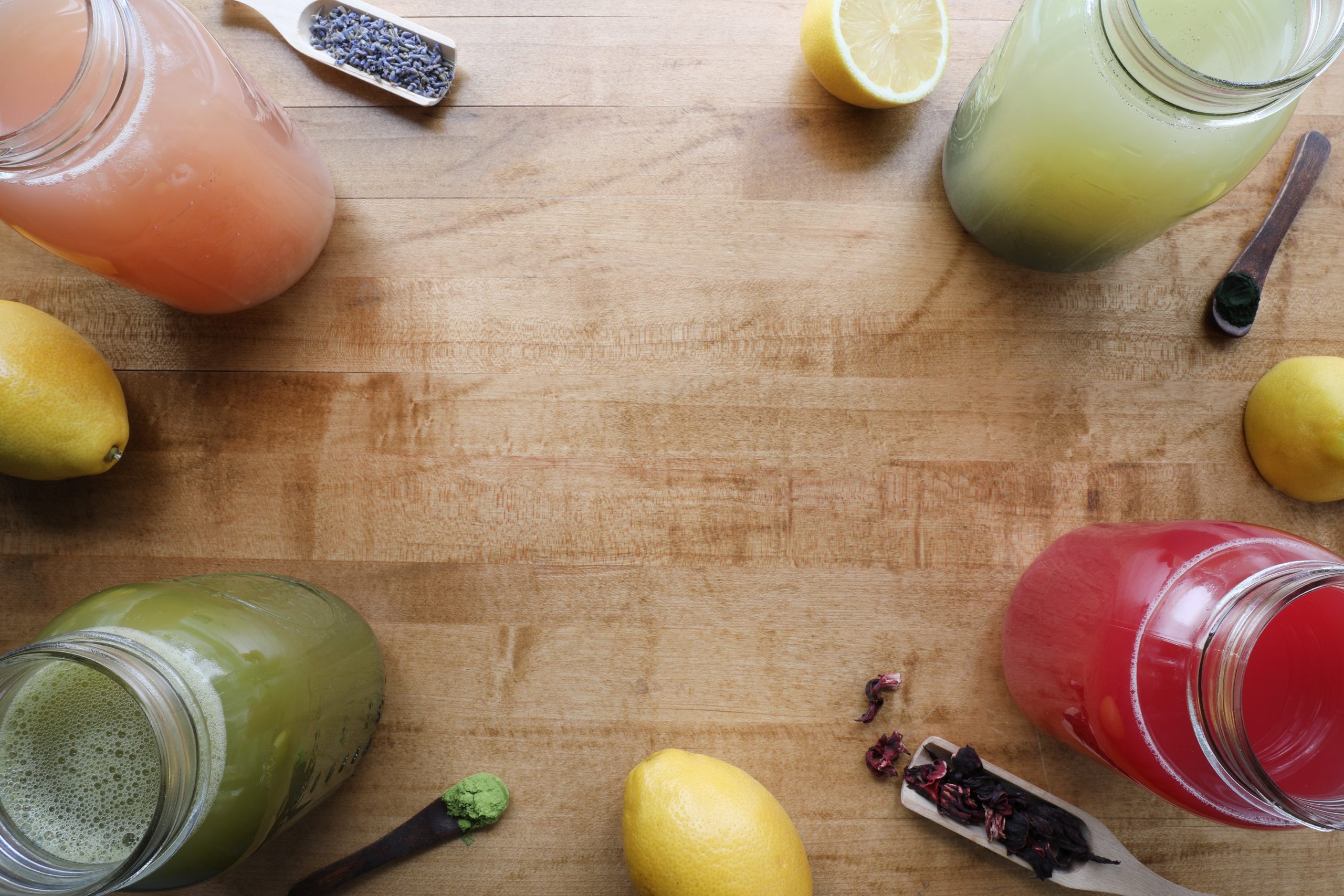 Display of colorful iced beverages and botanicals. 