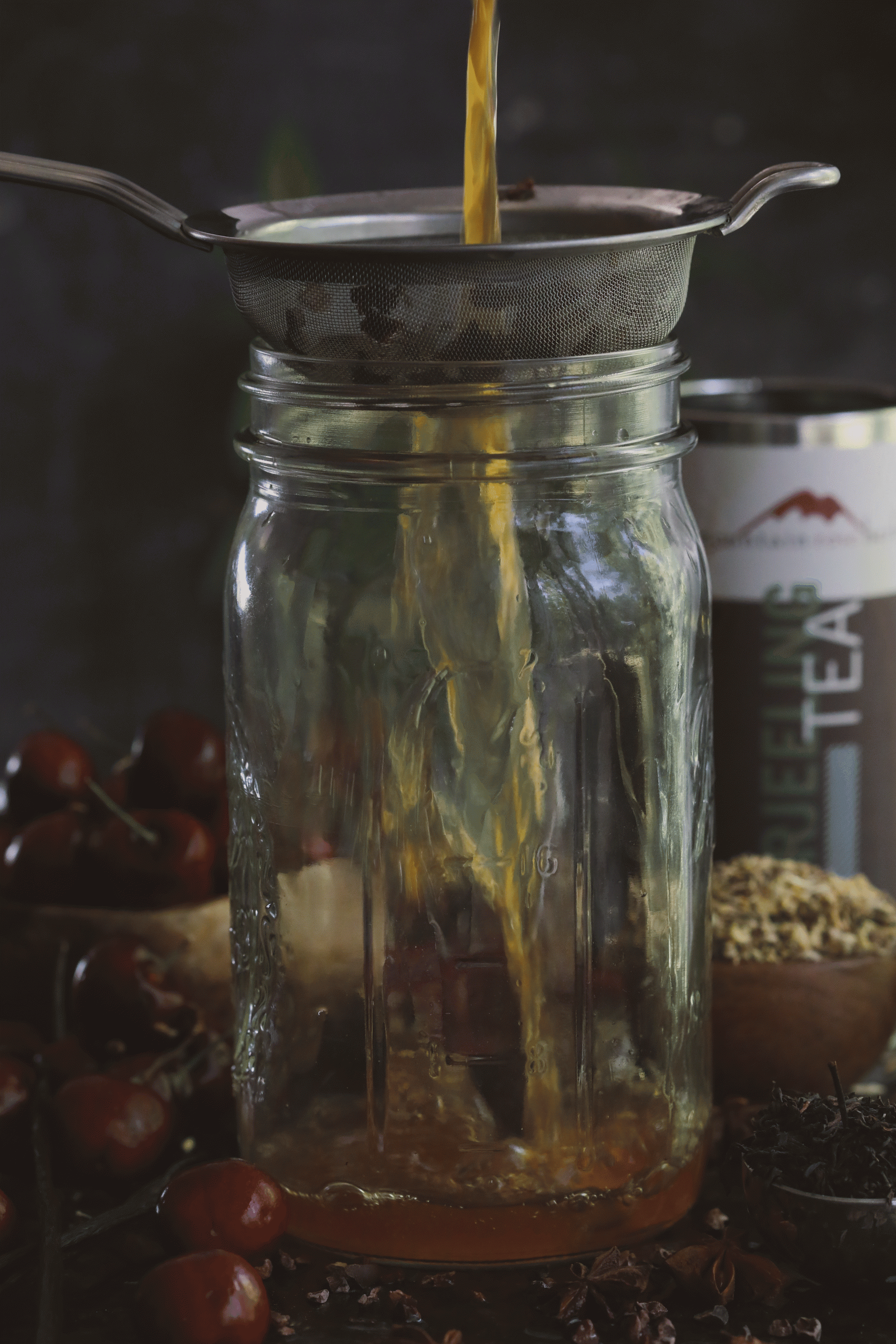 Video of straining tea into a jar