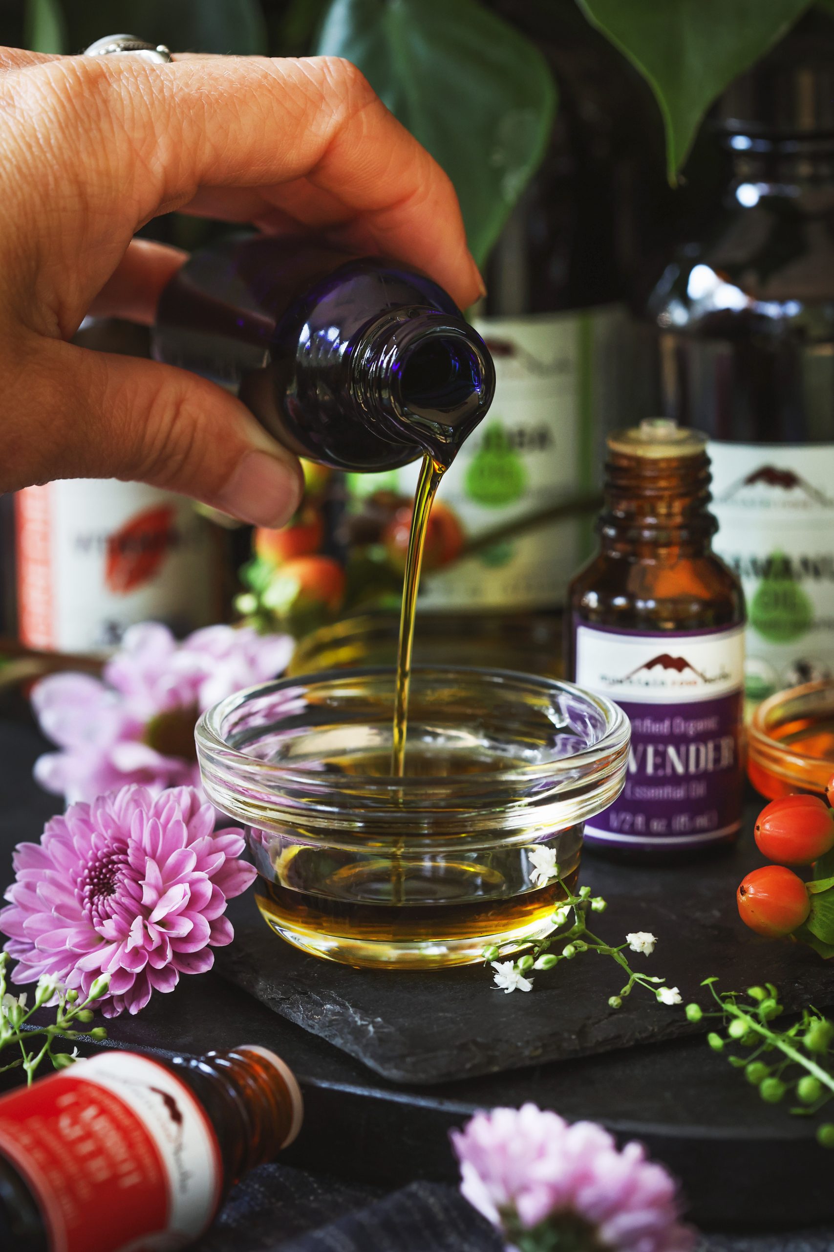 Tamanu skin serum is poured into a small glass bowl