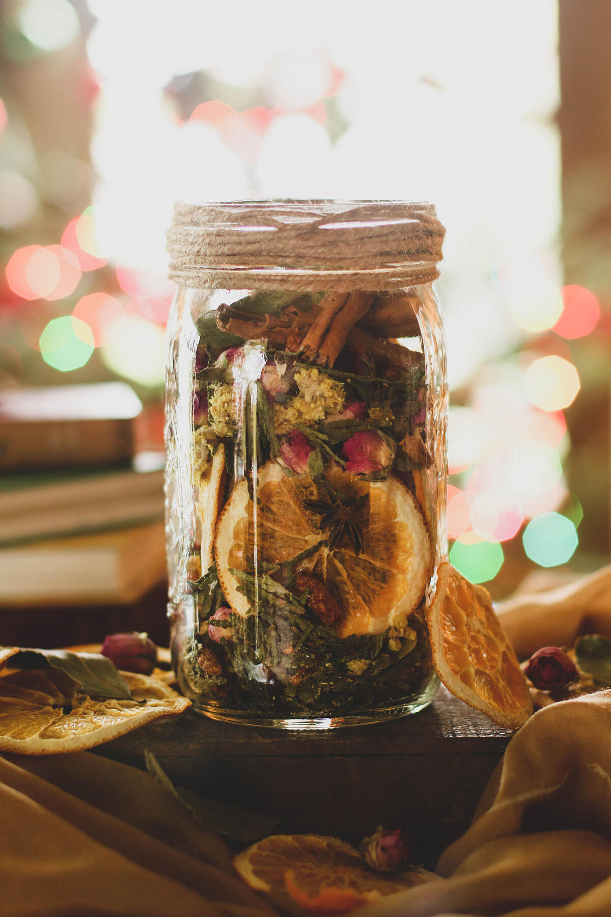 Jar of dried orange and spices in a mason jar. 