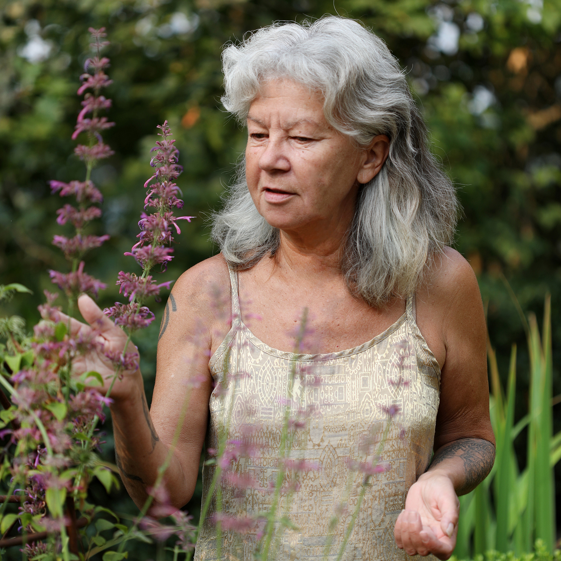 Mountain Rose Herbs co-owner Julie Baliey walks through her home garden of herbs in Eugene, Oregon.