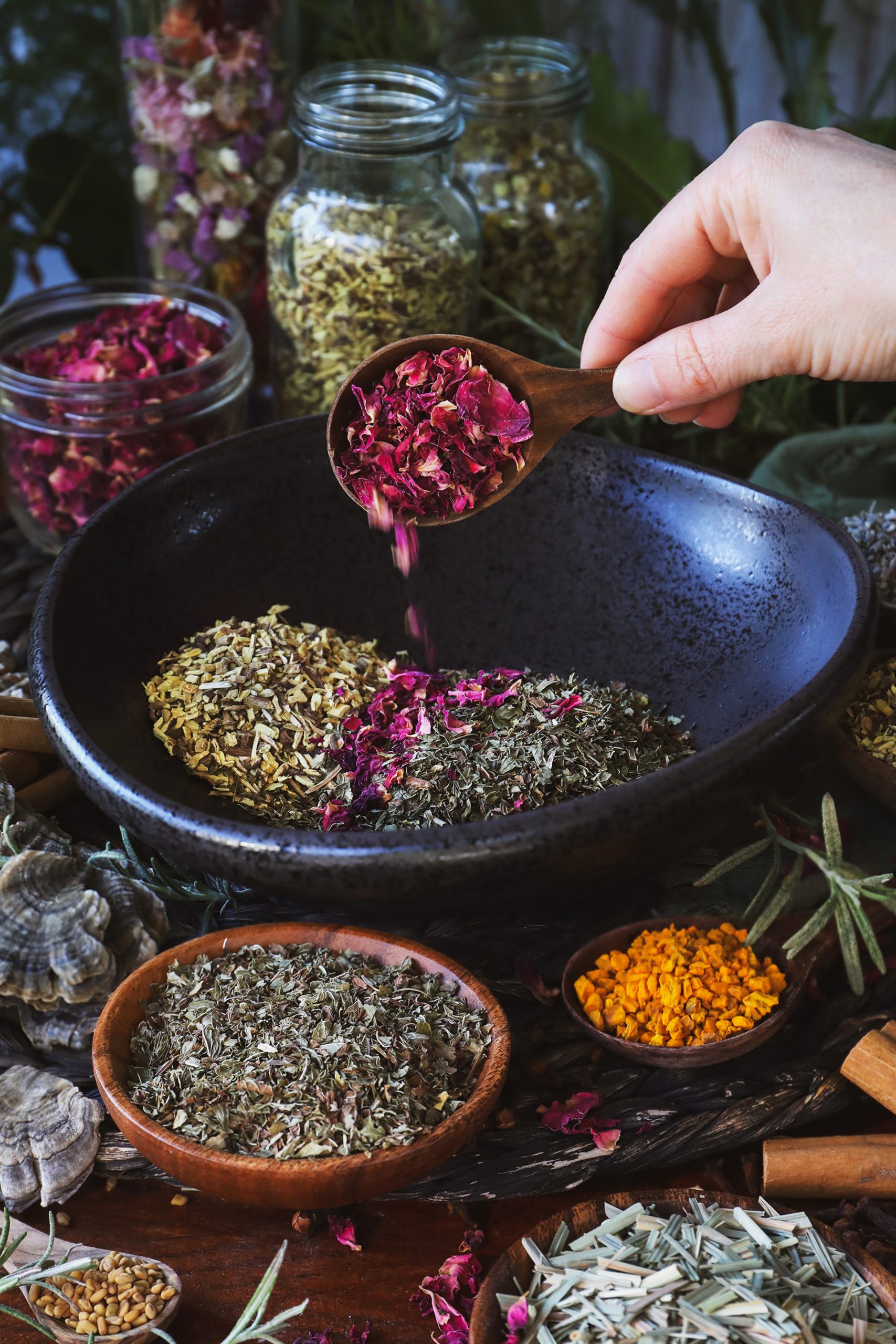 A photo of an herbal preparation being blended in a bowl
